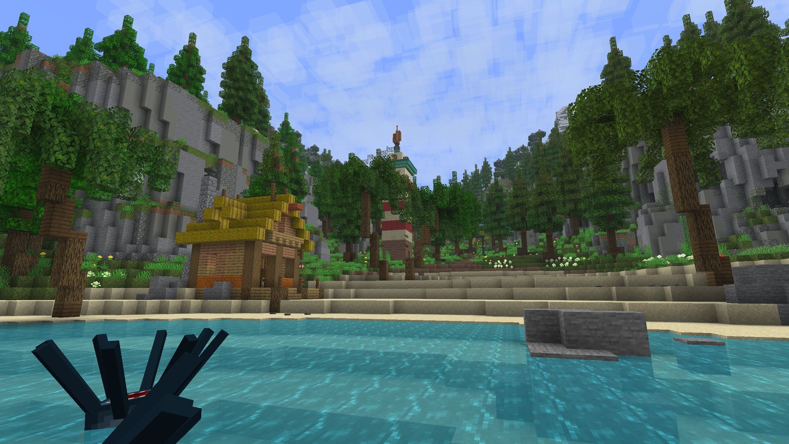 A turquoise cove with a thatched house and the lighthouse behind
