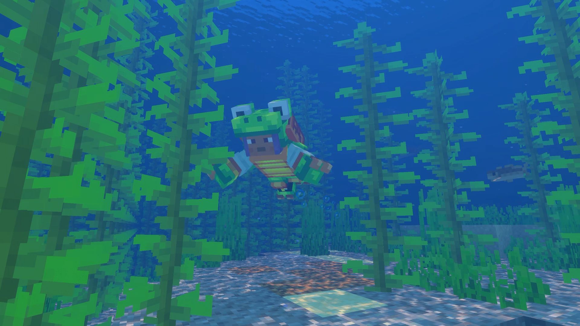 A player in turtle armor swims among kelp underwater